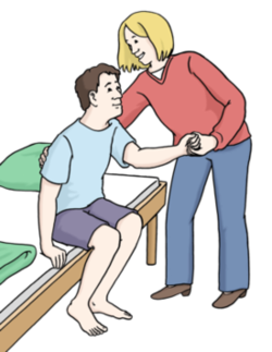 Frau hilft Mann aus dem Bett